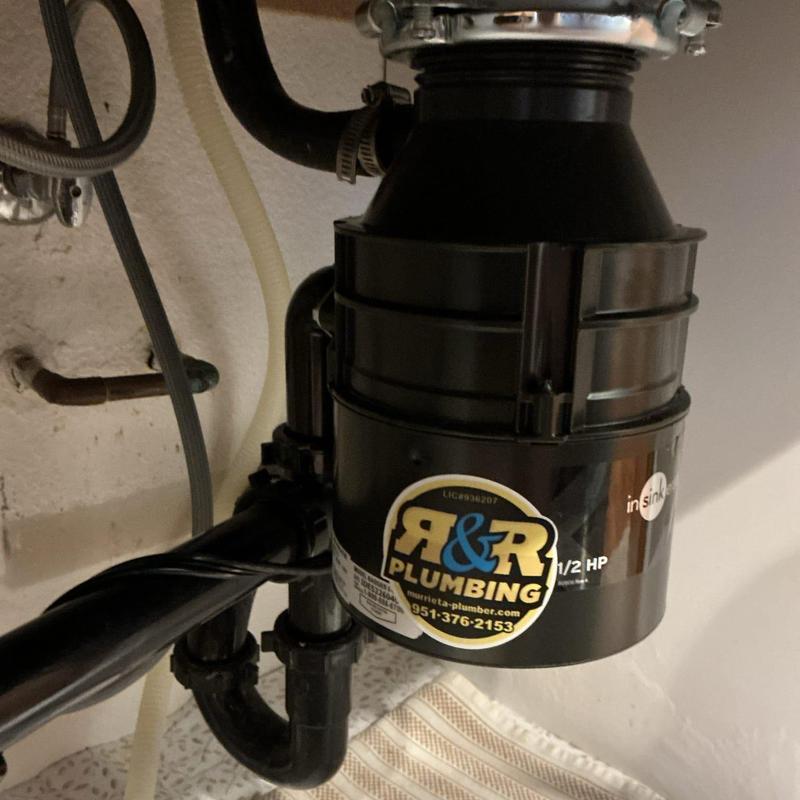 Garbage disposal unit installation under sink