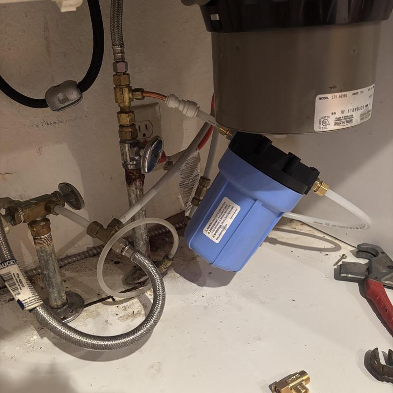 Reverse osmosis system installation under kitchen sink