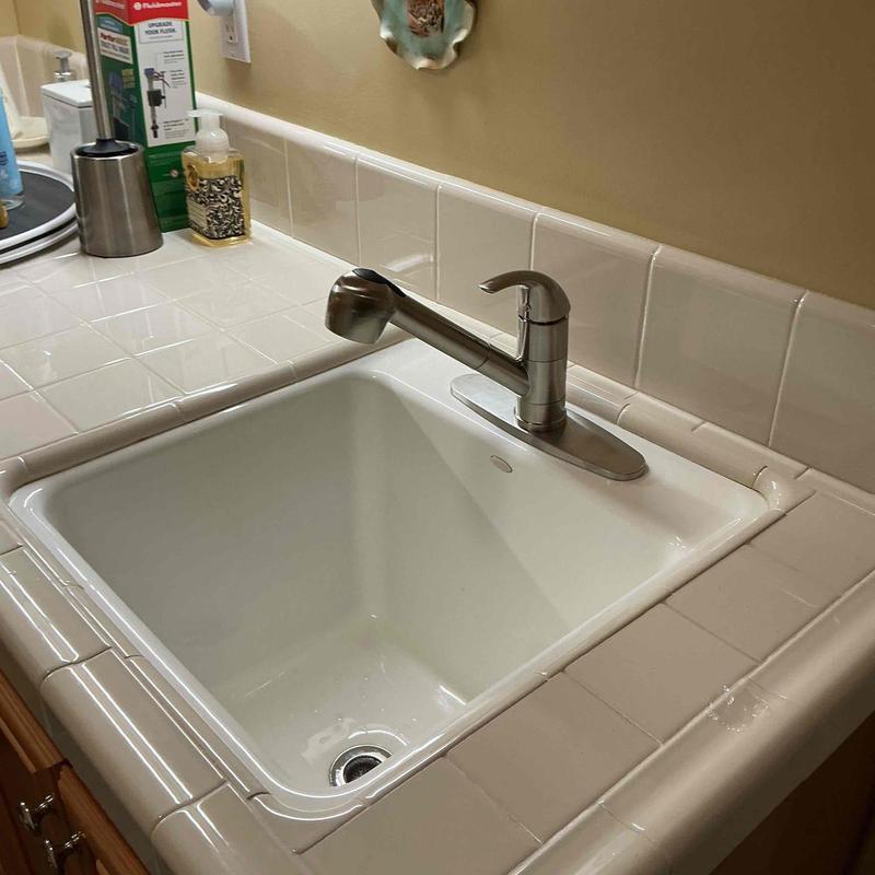 Laundry room faucet and tile countertop installation