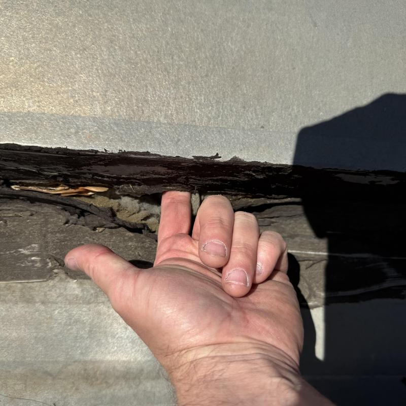 Commercial roof membrane gap with hand inspection