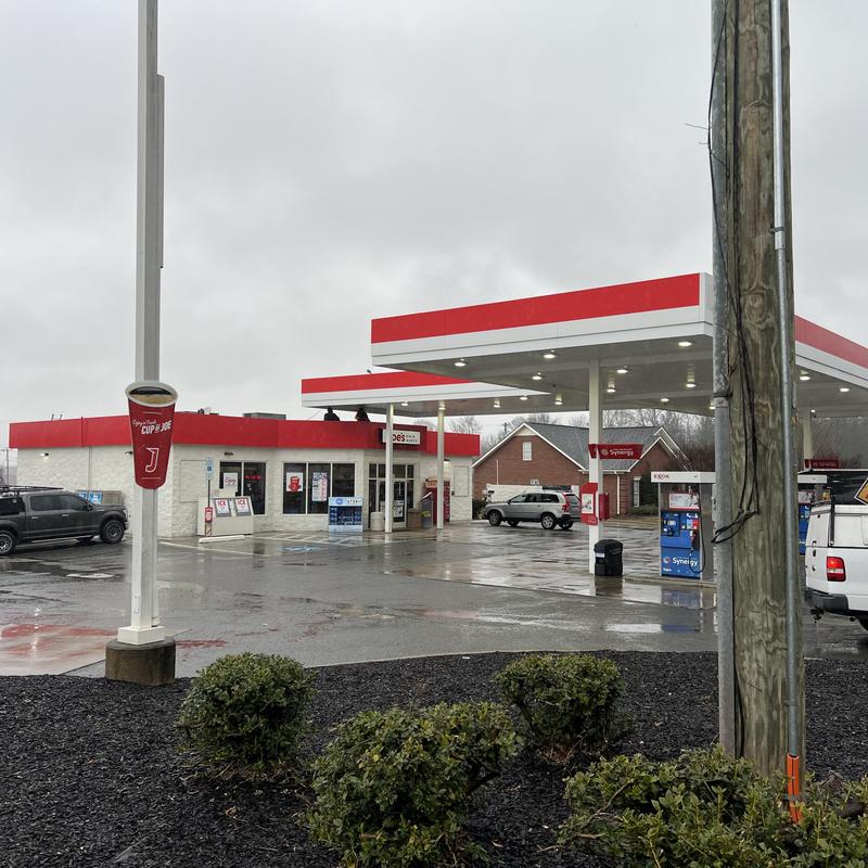 EPDM roof seams with primer and cover tape at Exxon station