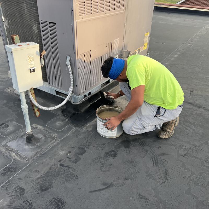 EPDM roof seam sealing at rooftop HVAC unit
