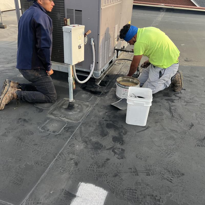 EPDM roof seams repair at rooftop HVAC unit