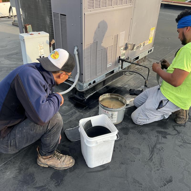 EPDM roof seam repair with primer and sealant application