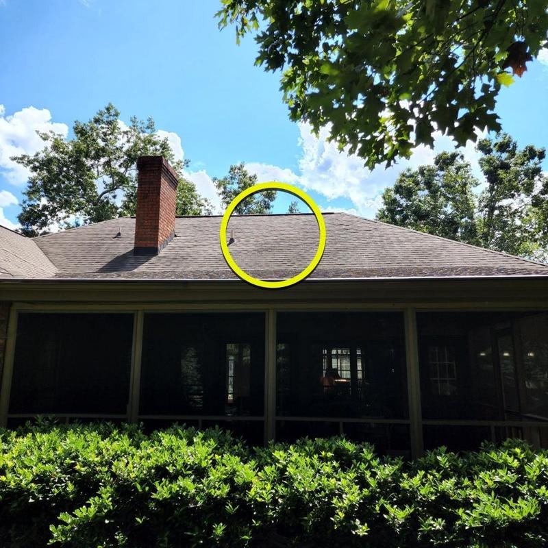 Pipe boot leak on residential roof with chimney Pipe boot leak on residential roof with chimney