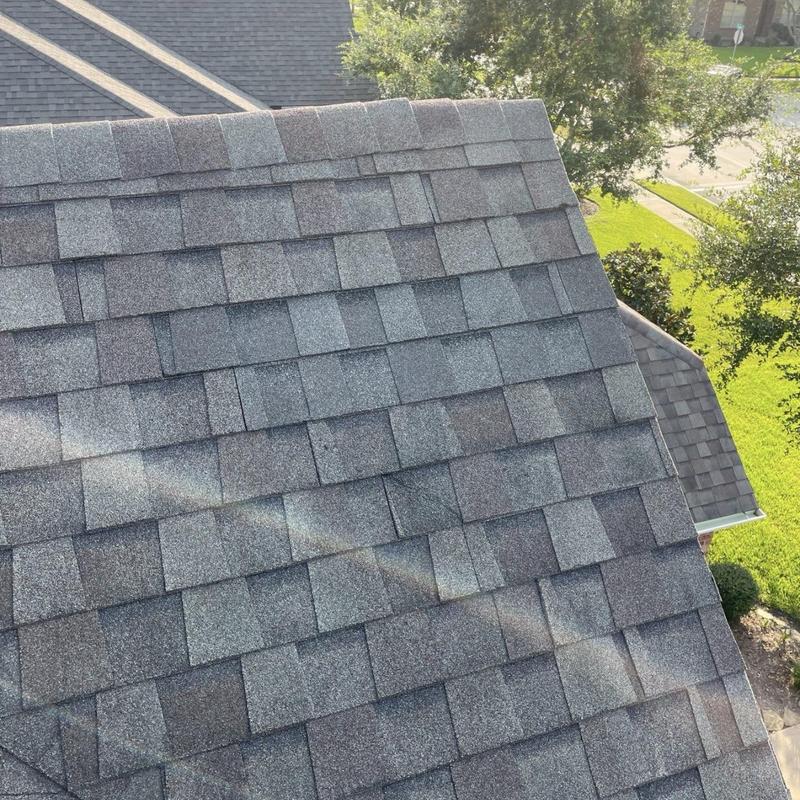 Architectural roof shingles near ridge and slope transitions