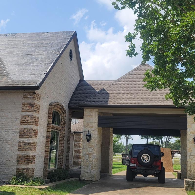 Roof shingles with hail damage under inspection in Terrell TX