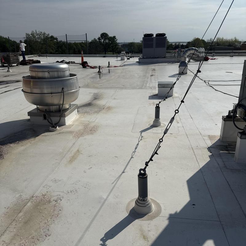TPO roof with vent and safety lifeline anchors