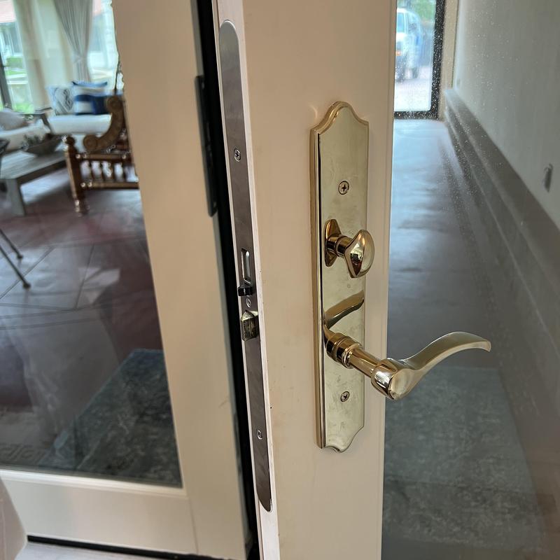 Door handle and lockset on glass door unlock service