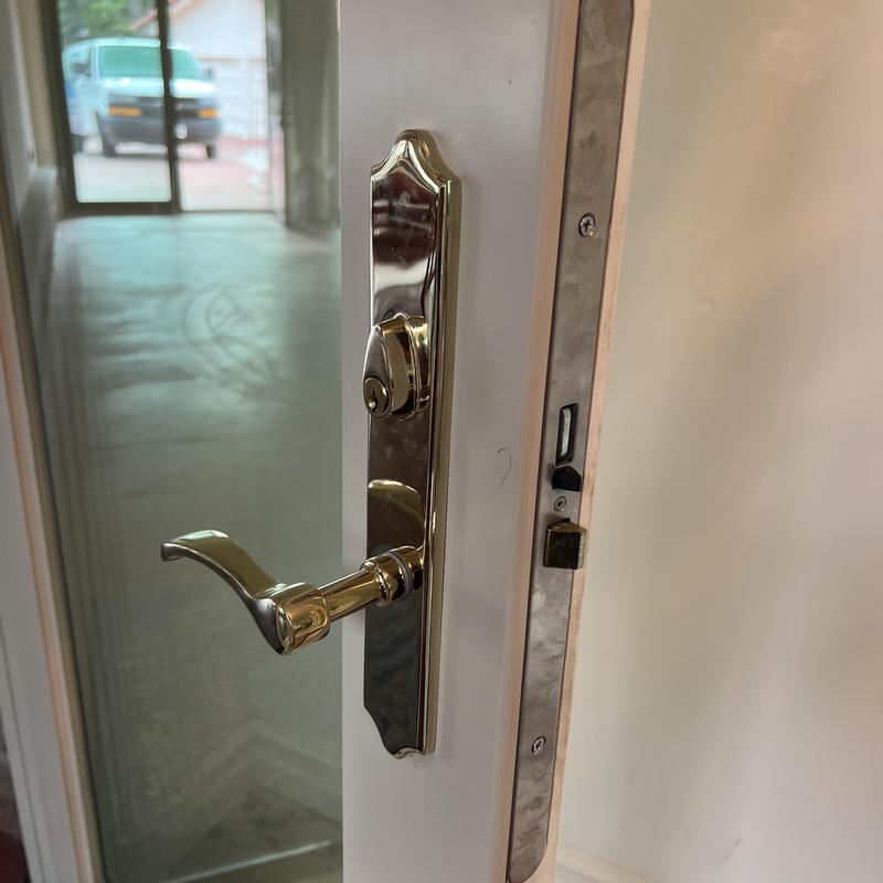 Door handle and lockset on open house door