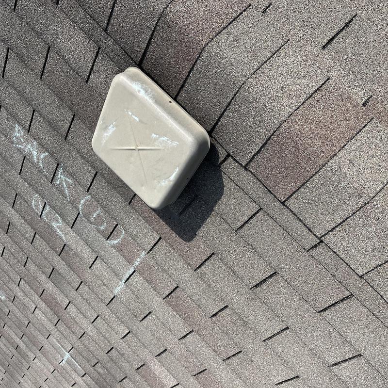 Roof vent on shingle roof with chalk markings