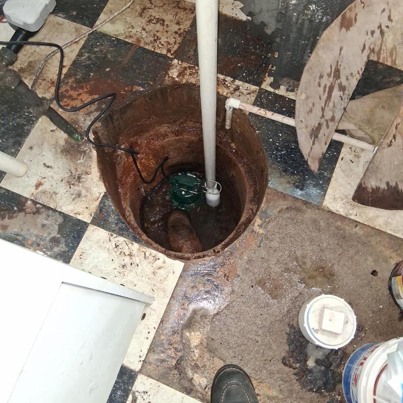 Sump pump installation in basement floor opening