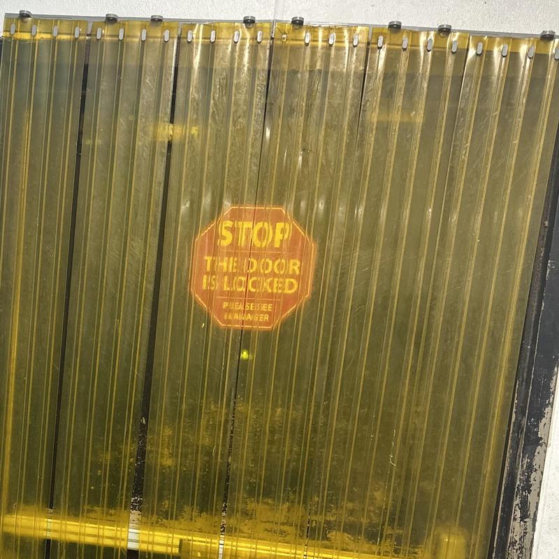 Detex alarm exit door with yellow safety strips