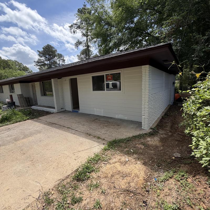 Exterior walls and trim of residential home painted