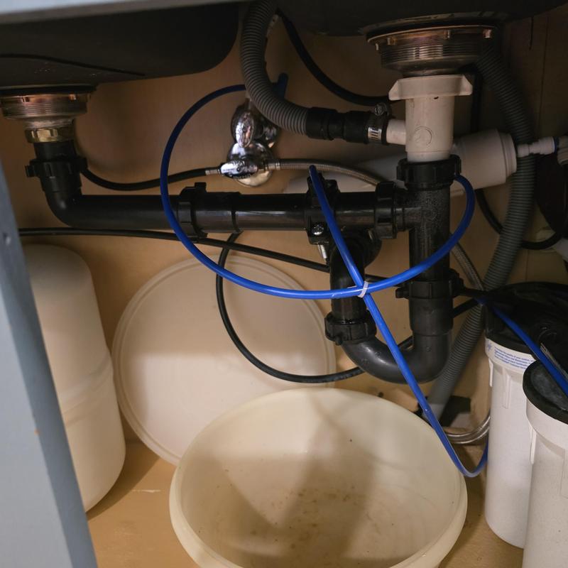 Continuous waste drain assembly under kitchen sink with tubing