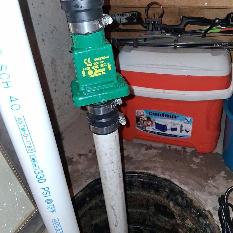 Sump pump discharge pipe with check valve installation