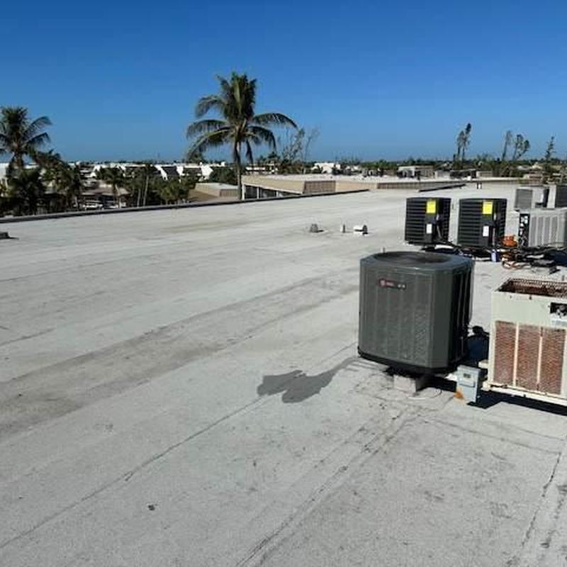 Flat commercial roof with HVAC units on top