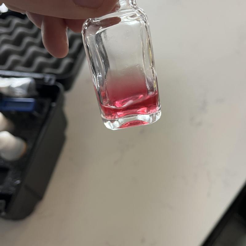 Water softener test solution in small glass vial