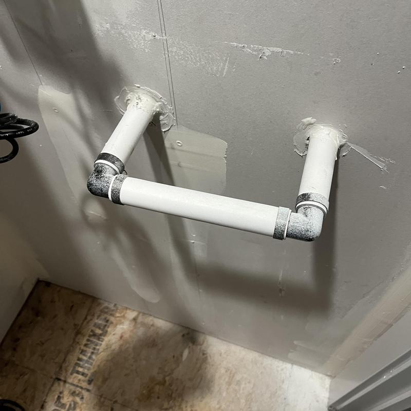 Water softener plumbing pipe connection on wall