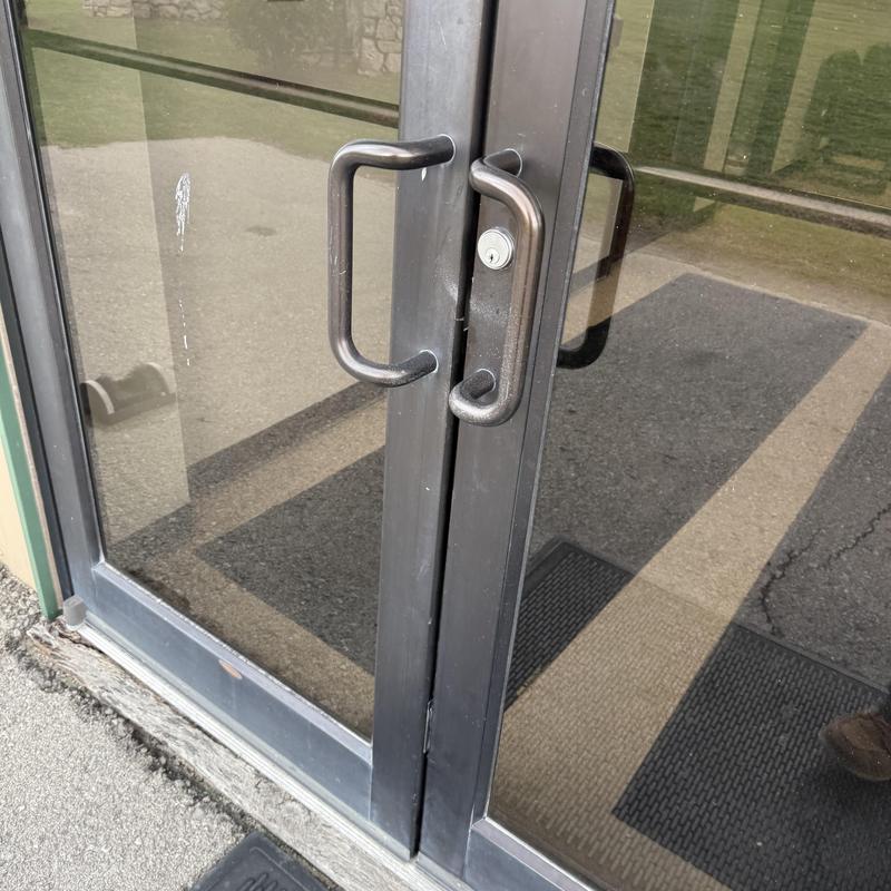 Mortise key cylinders with door handles on glass doors