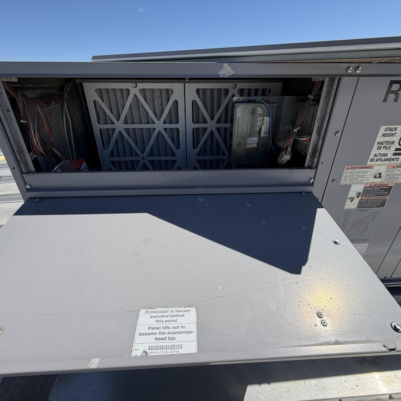 HVAC unit air filter compartment with open panel