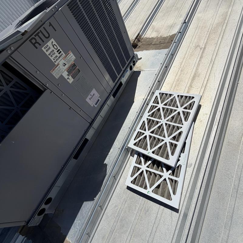 Rooftop unit air filters removed on metal roof