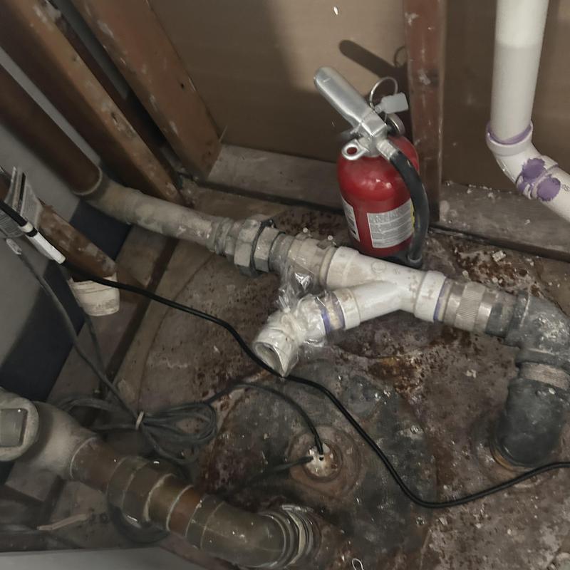 Sump pump with connected camera inspection cable and pipes Sump pump with connected camera inspection cable and pipes