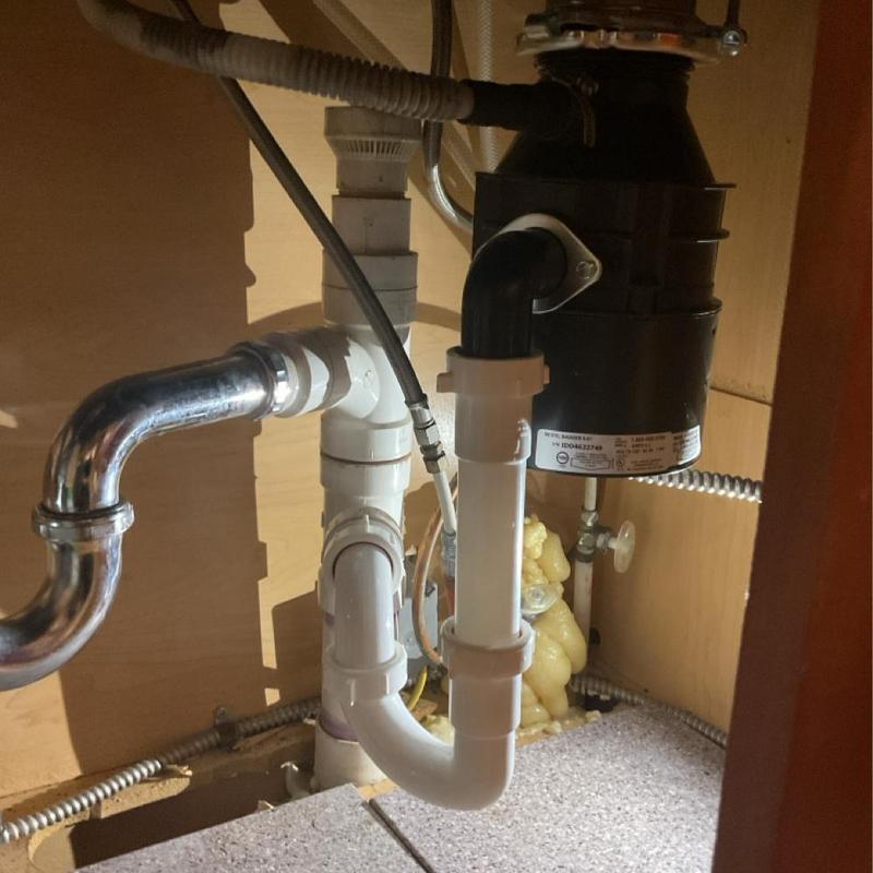 Garbage disposal and under-sink plumbing installation