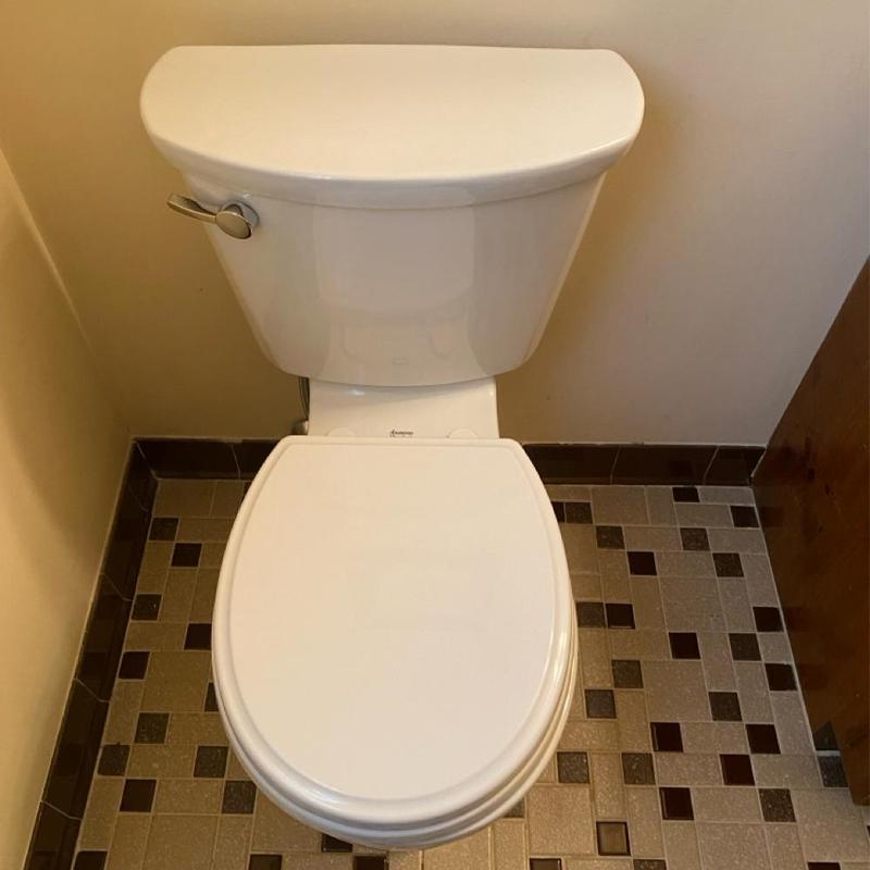 American Standard toilet installed in residential bathroom