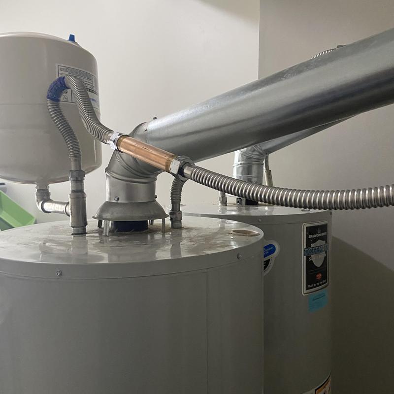 Water heaters with vent piping and pressure tank connections