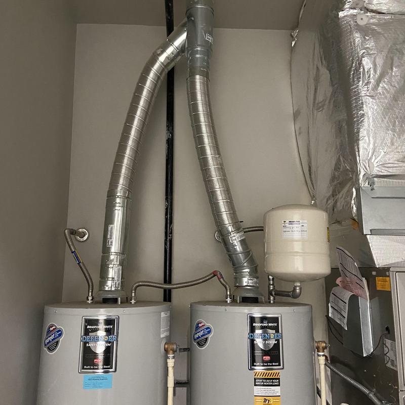 Water heater drain and relocation for water damage repair
