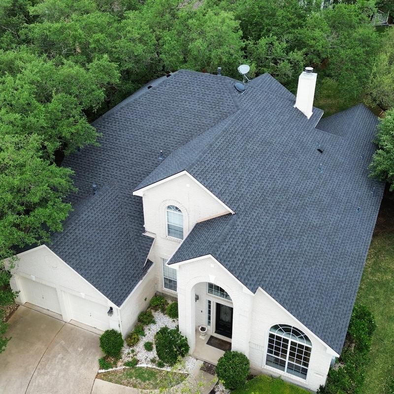 GAF charcoal shingle roof with new gutters in Austin
