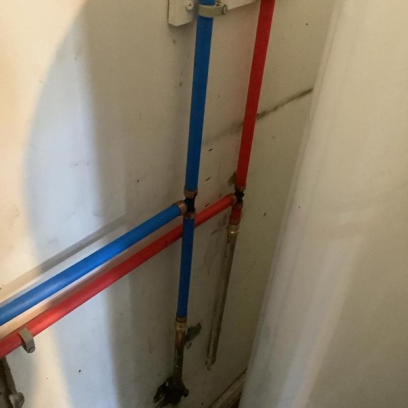 Water heater re-piping with red and blue PEX piping