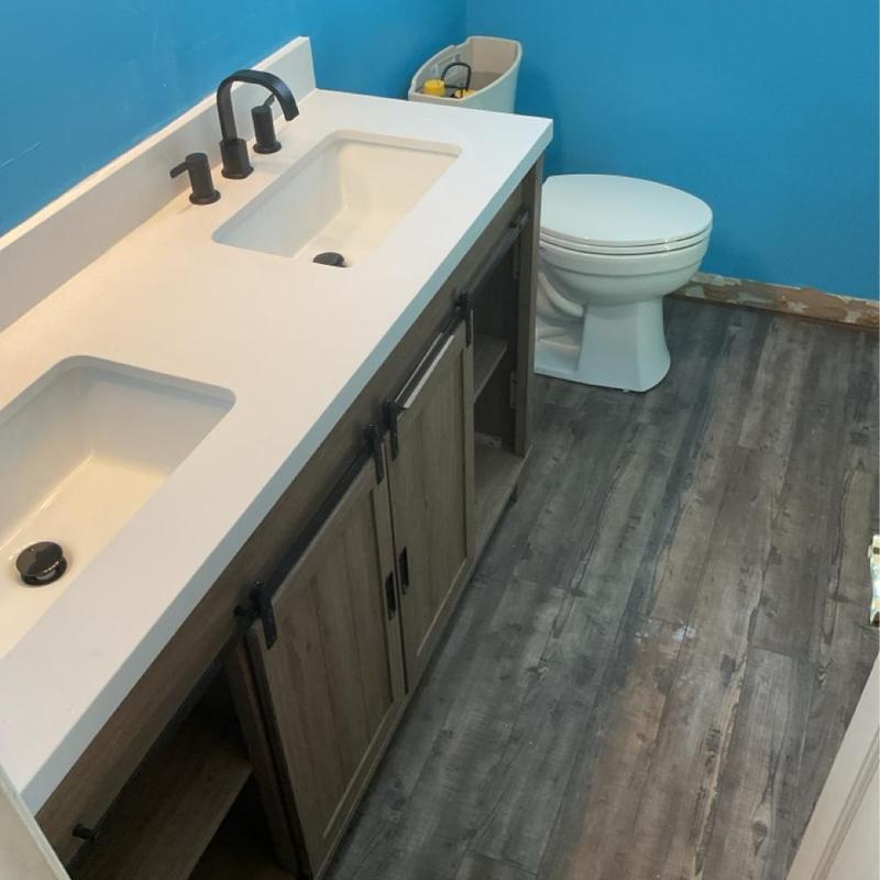 Double bowl lavatory sink and vanity with toilet installation