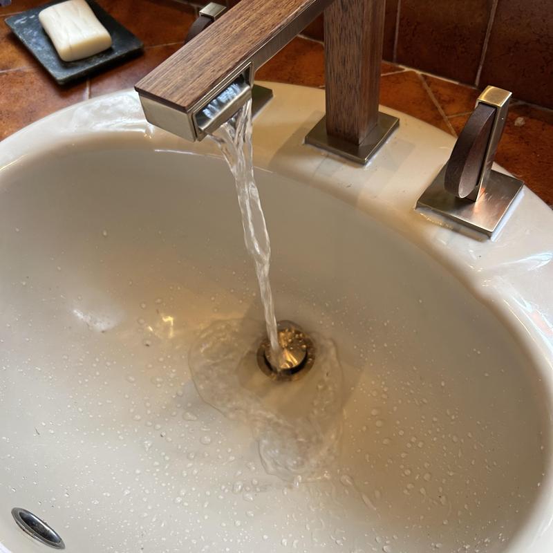 Bathroom sink faucet with water running during installation