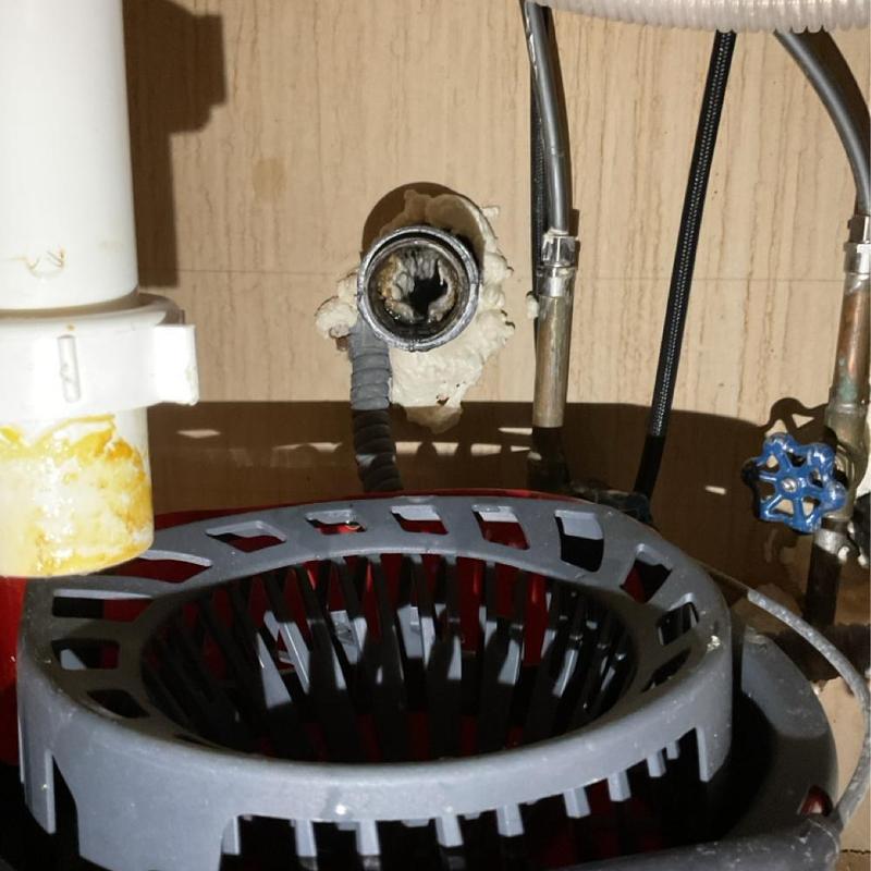 Kitchen drain pipe with cleaning tool under sink Kitchen drain pipe with cleaning tool under sink