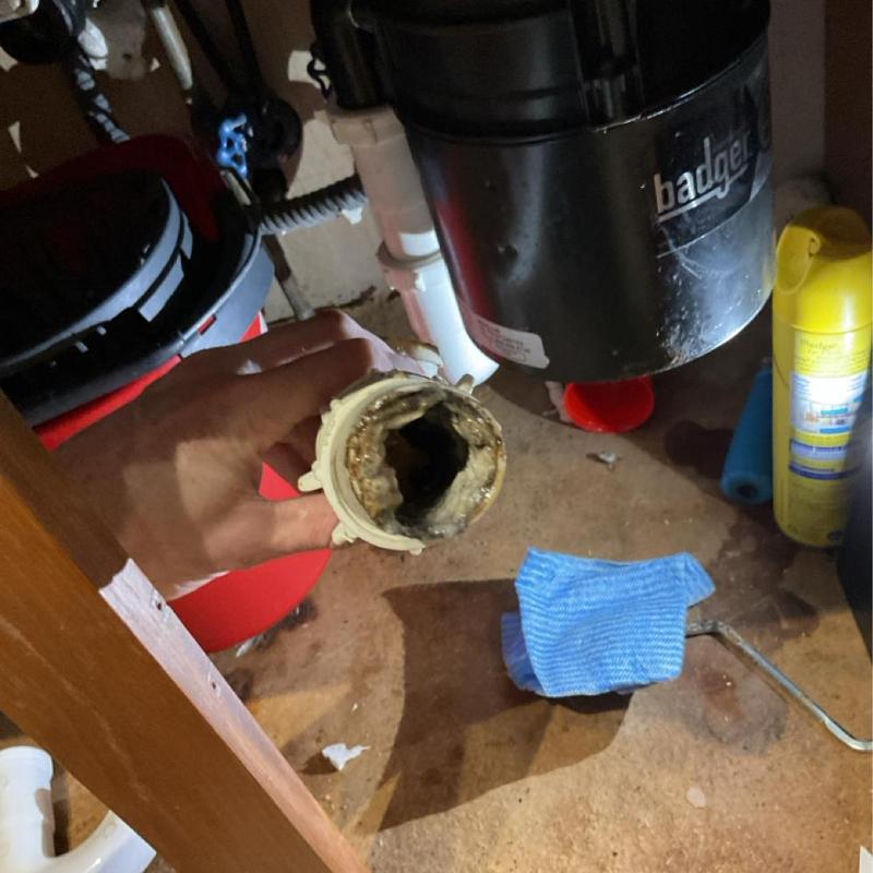 Kitchen drain pipe clogged with grease buildup Kitchen drain pipe clogged with grease buildup
