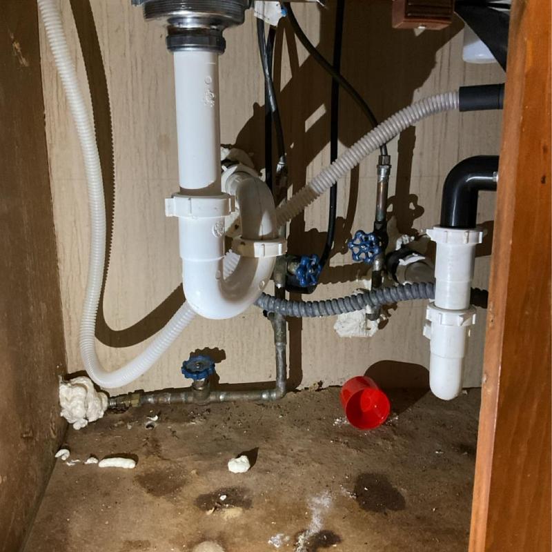 Kitchen sink drain pipes and shutoff valves under cabinet Kitchen sink drain pipes and shutoff valves under cabinet
