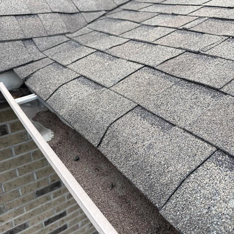 Asphalt shingles with hail damage on residential roof