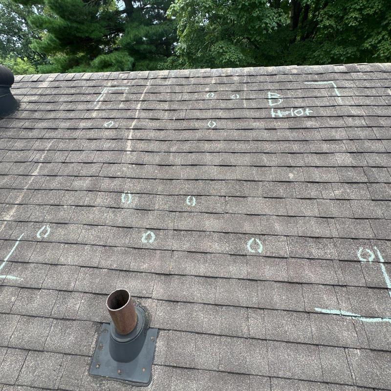 Roof shingles with hail damage markings and assessments