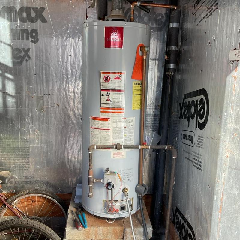 50-gallon gas water heater installation in utility room