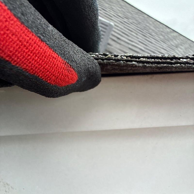 Roofing shingles edge lifted for hail damage inspection