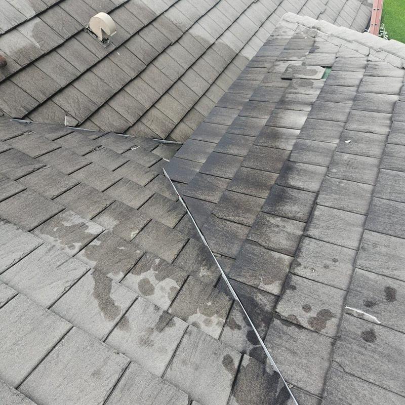 Concrete tile roof with repaired leak and replaced tiles