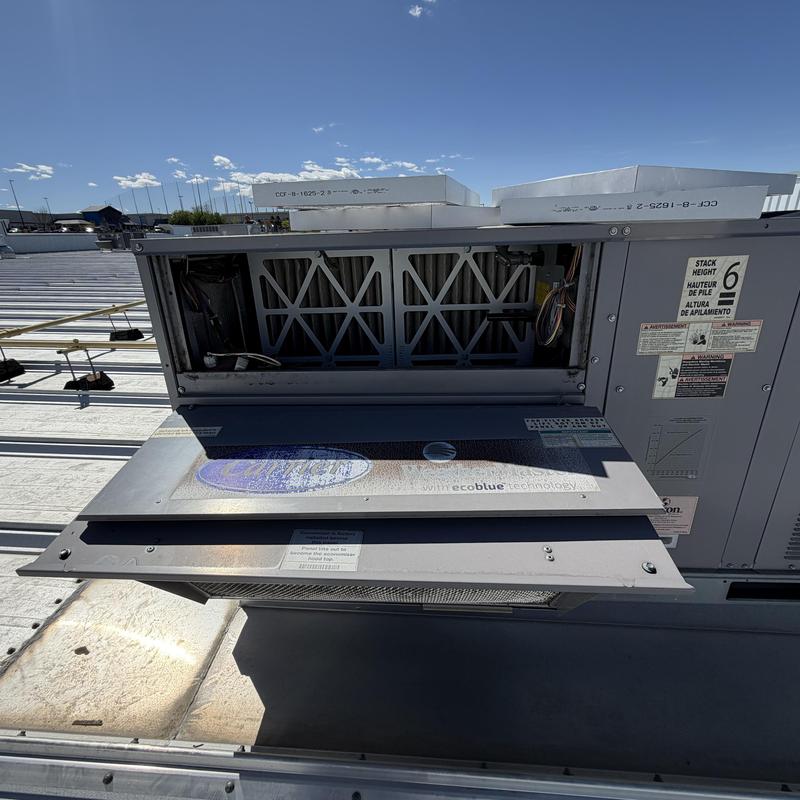 Commercial rooftop HVAC unit with open access panel