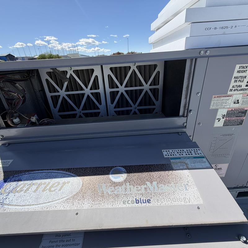 WeatherMaster HVAC unit filter access panel open outdoors