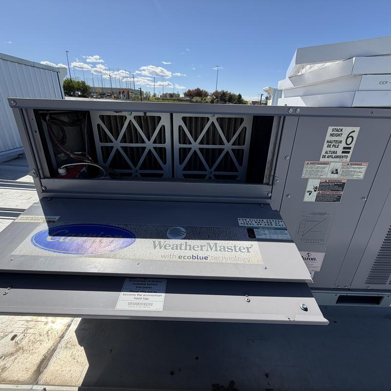 WeatherMaster rooftop HVAC unit with open panel outdoors