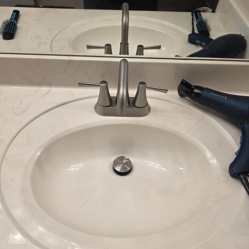 Four-inch lavatory faucet and sink installation in bathroom