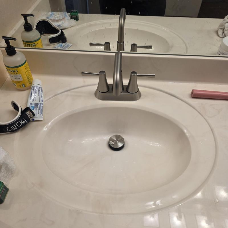 Four inch lavatory faucet on marble countertop