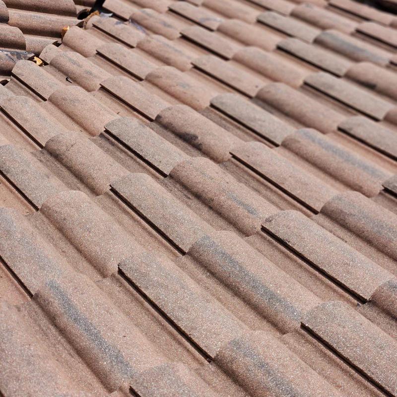 Concrete tile roof showing repaired decking area