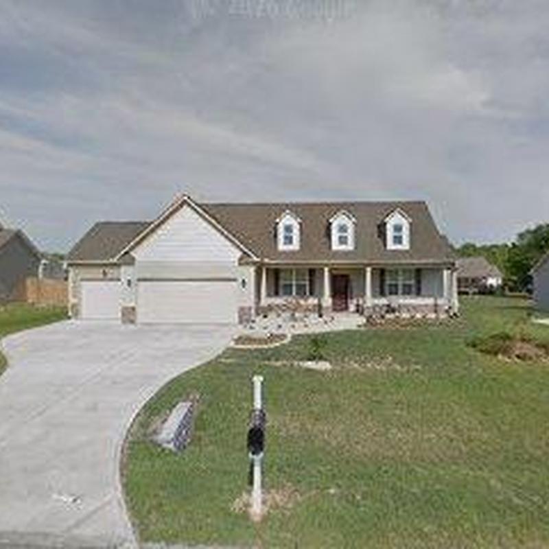 House exterior siding and stone trim installation